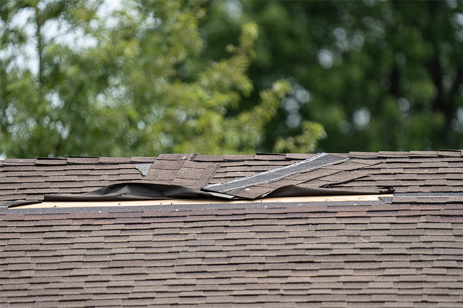A damaged felt tile roof.