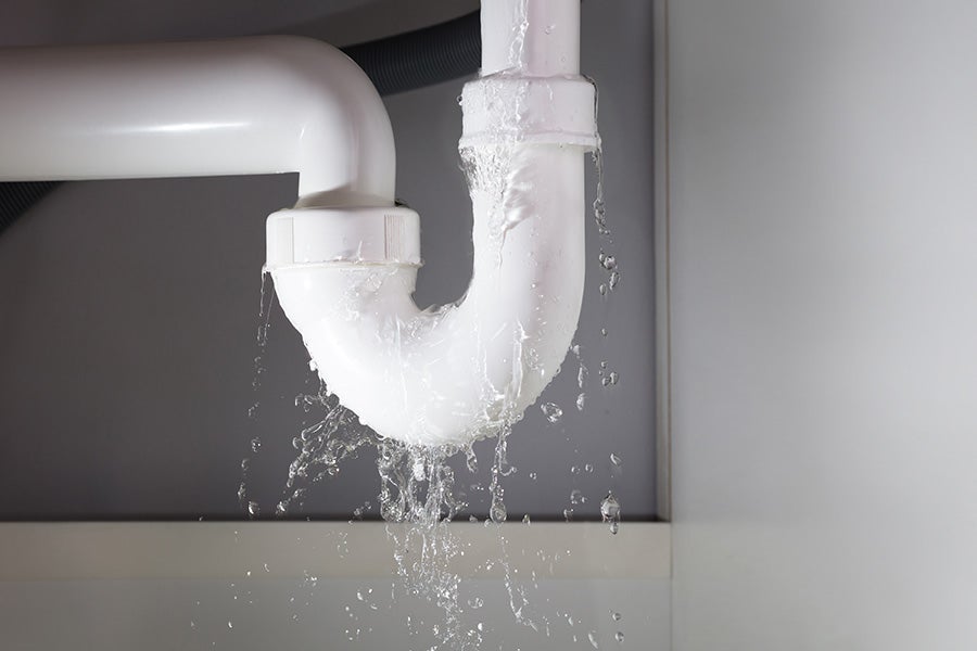 A leaking pipe under the sink.