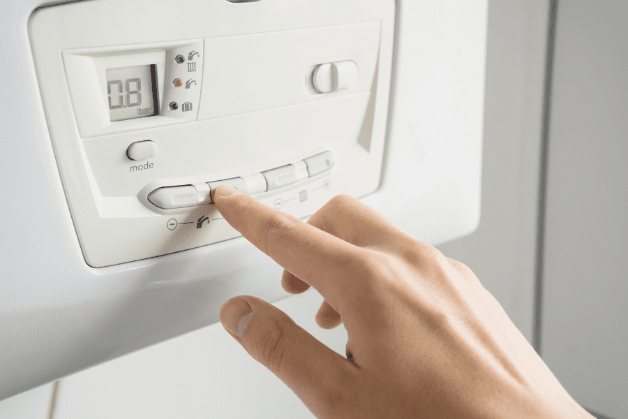 Person increasing the flow temperature of their boiler to prevent a frozen condensate pipe