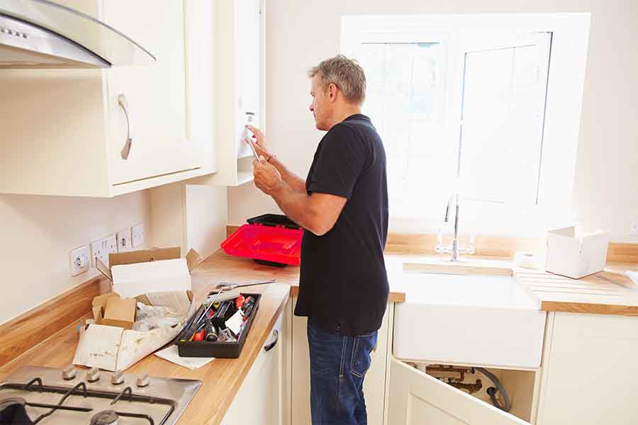 Man installing new boiler