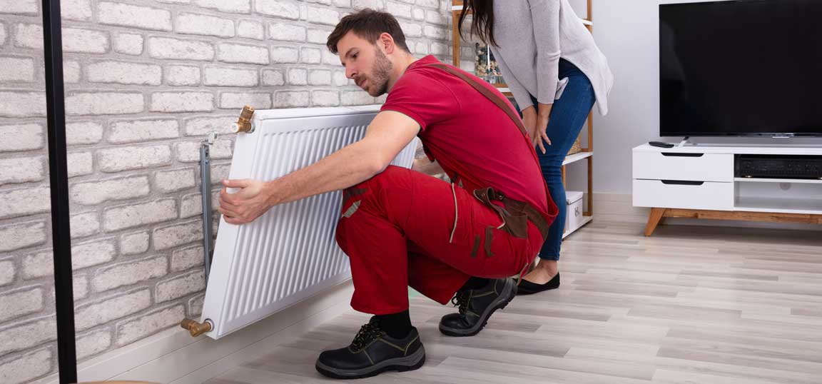 Man removing radiator