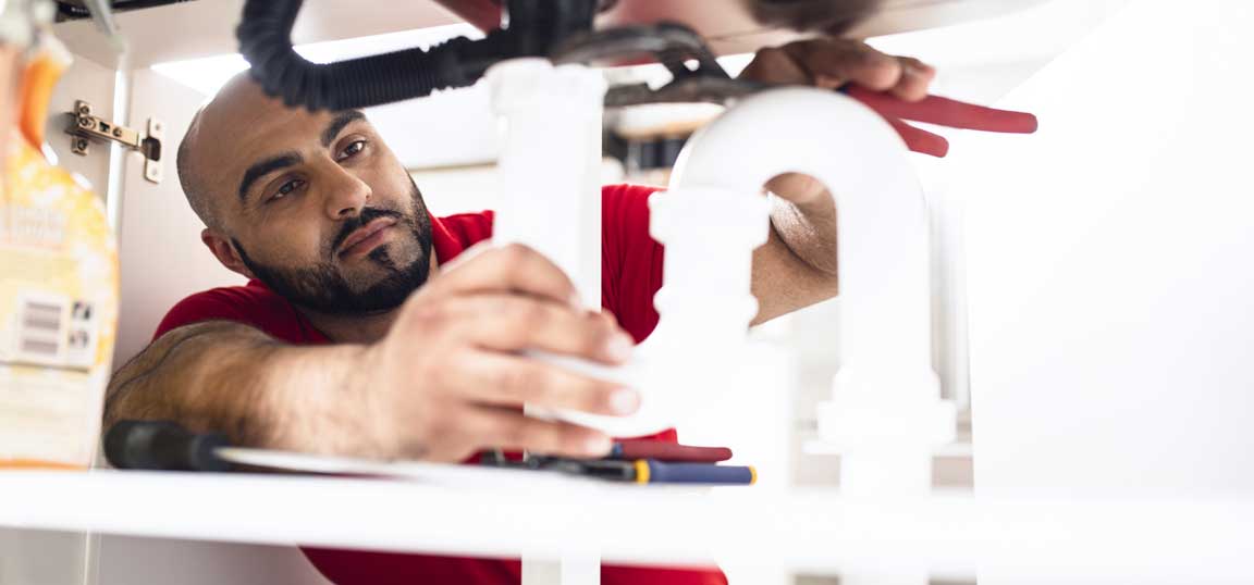 Engineer fixing pipe