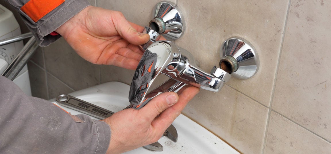 Man fixing tab