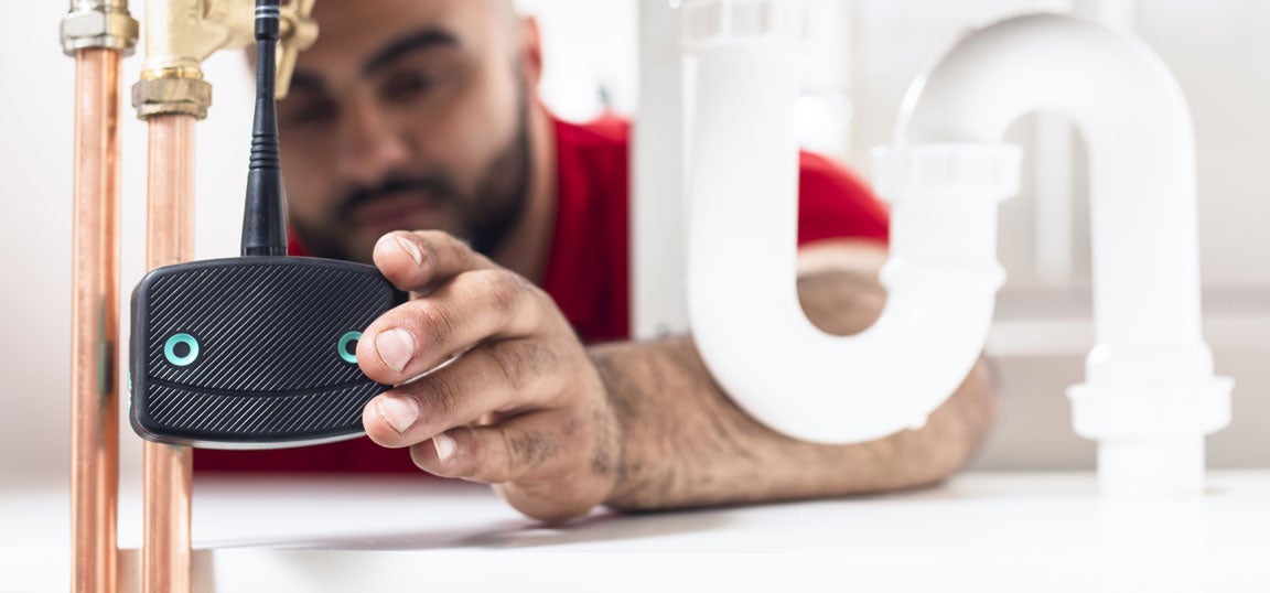 Man installing Leakbot