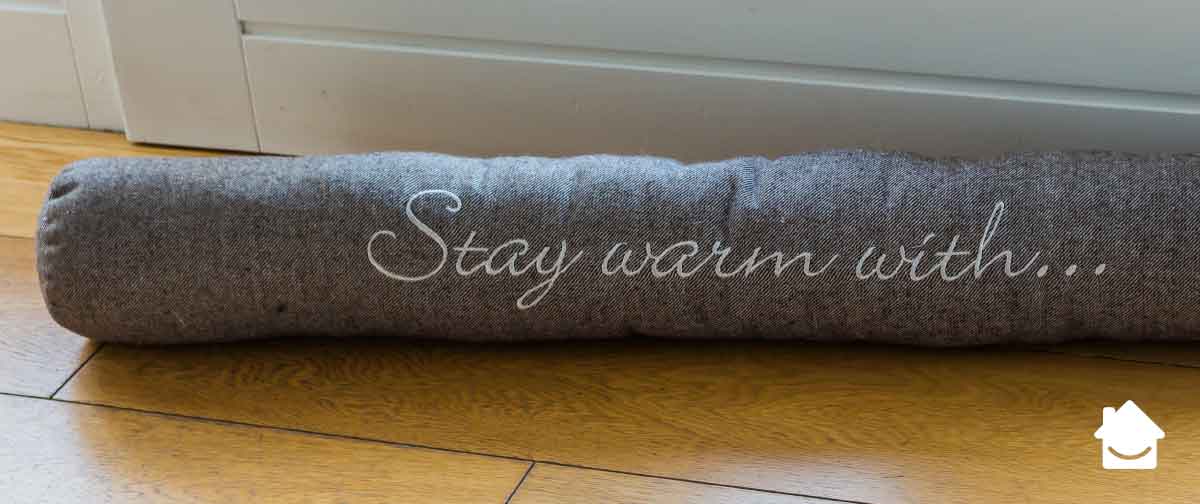 Draught excluder by door