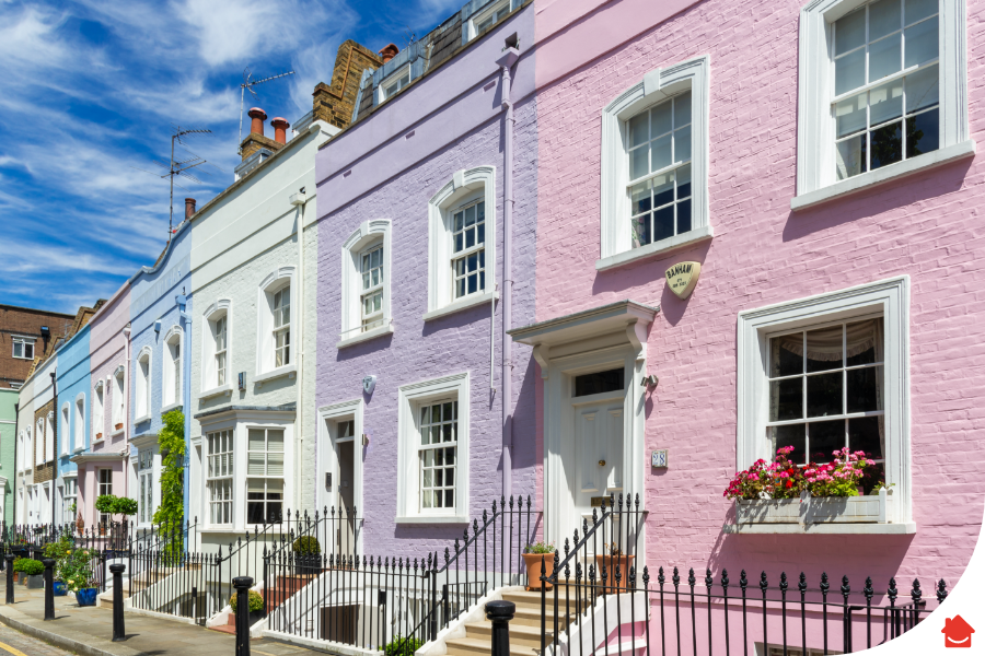 A row of colourful terraced houses where the landlord has recently improved their EPC rating.