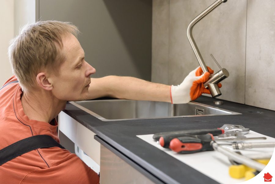 HomeServe engineer fitting in an isolation valve
