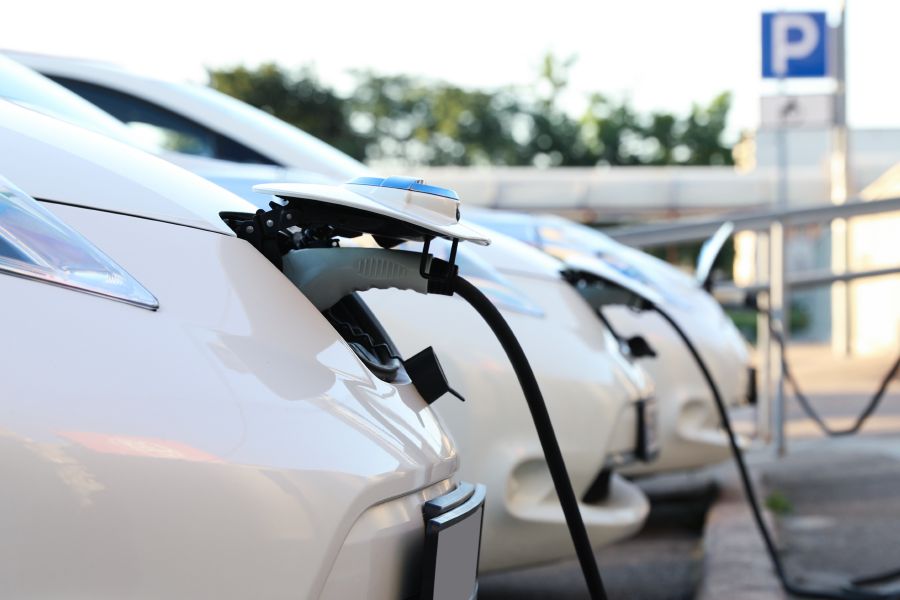 Electric car being charged at a car park charging point