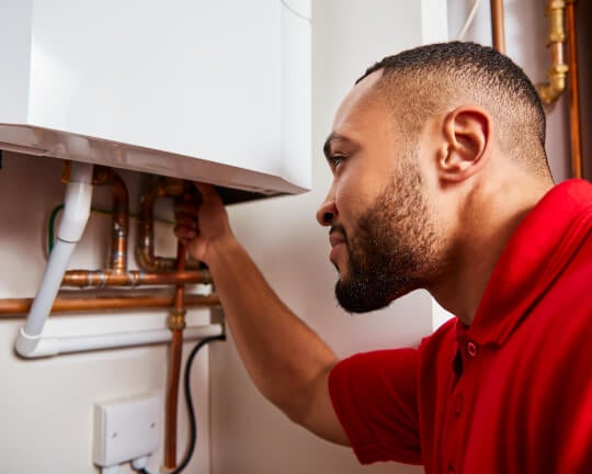 HomeServe engineer performing a service to validate a boiler warranty