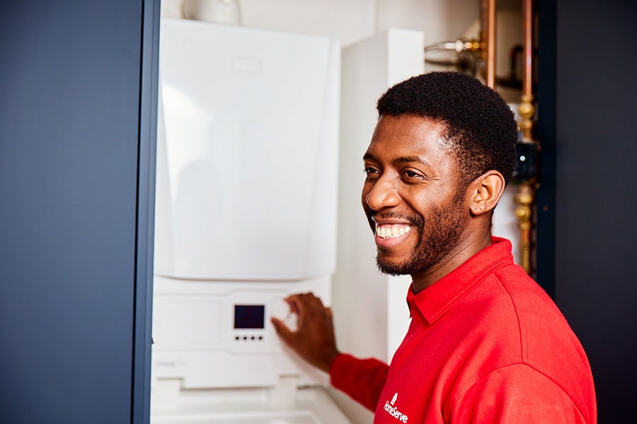 A HomeServe engineer completing a boiler service.