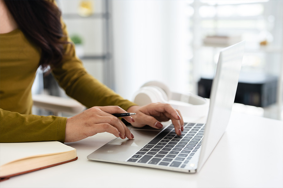 Landlord searching for insurance options on laptop