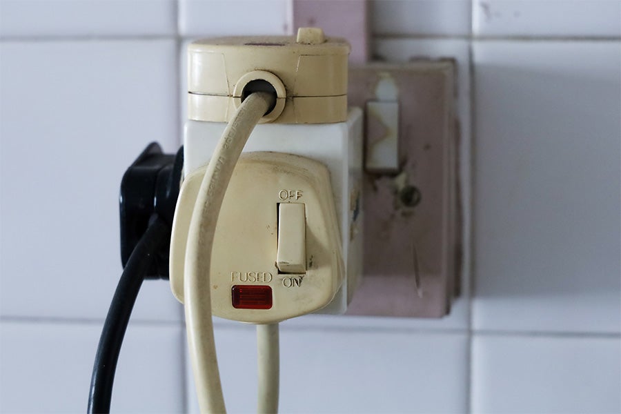 A socket with too many devices plugged in, which can lead to an overloaded circuit.