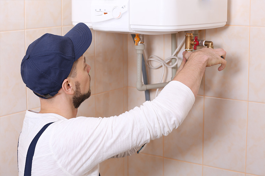 Engineer servicing an immersion heater.