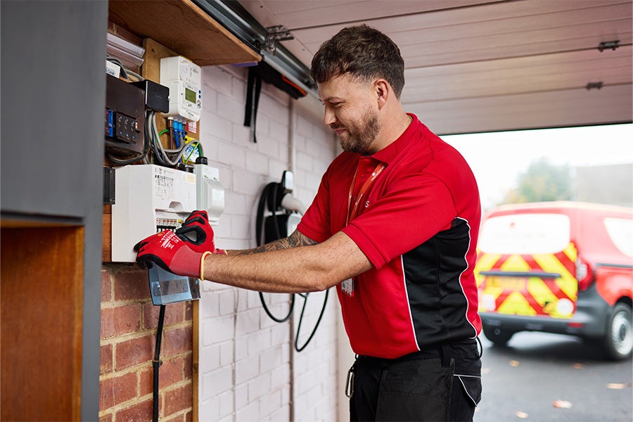 A HomeServe engineer troubleshooting fuse box issues.