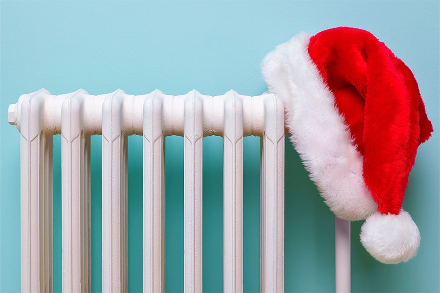 A santa hat on a radiator.