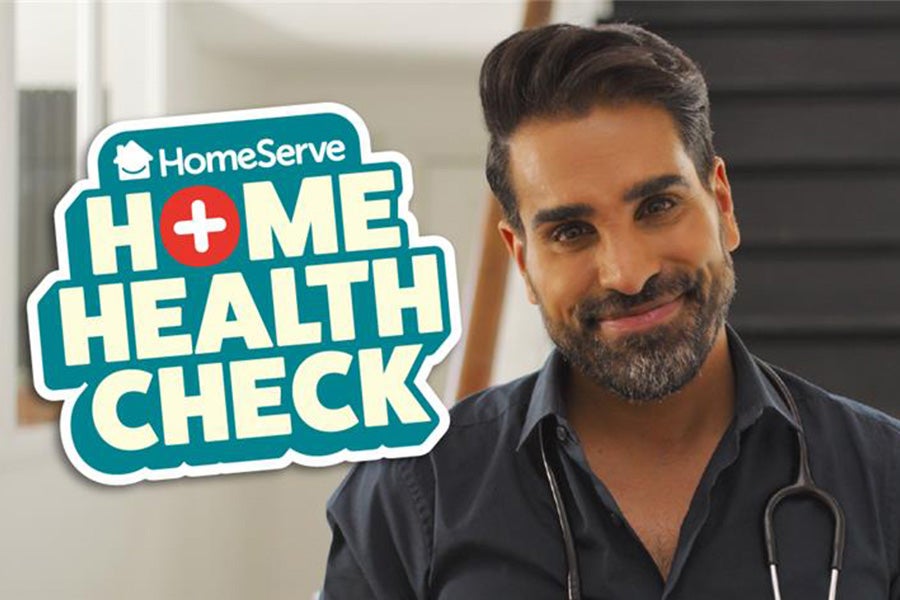 Dr Ranj Singh standing next to HomeServe's Home Health Check logo