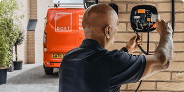 A BOXT electrician installing an EV charger. 