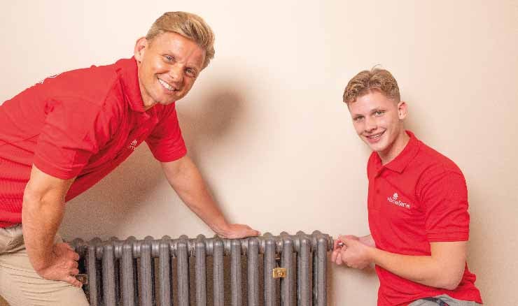 Jeff and Freddie Brazier bleeding a radiator.