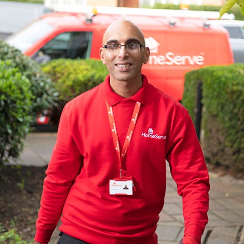 HomeServe engineer outside home with toolkit