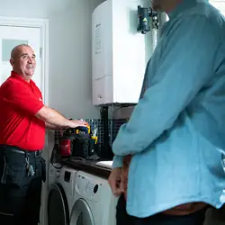 A HomeServe engineer fixing a boiler issue