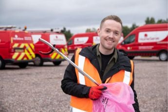 Nathan Hill, a HomeServe volunteer cleaning up Walsall's green spaces. 