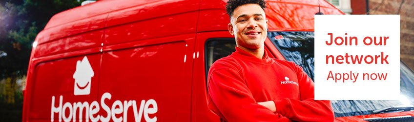  A HomeServe engineer standing in front of a red van