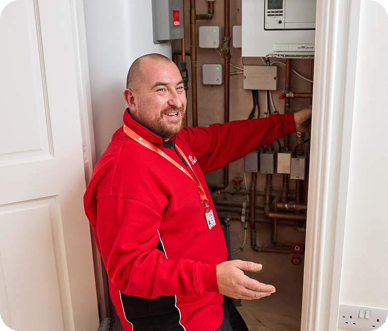 A HomeServe engineer checking boiler components during a boiler service.